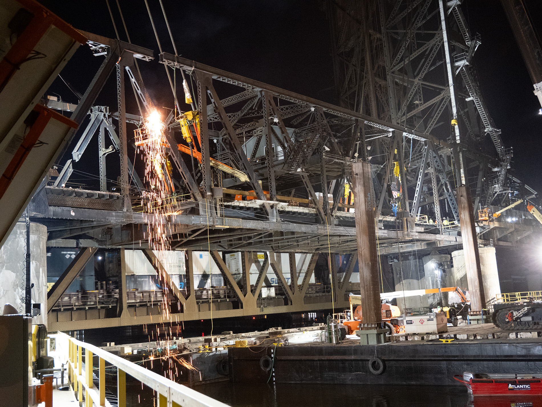 Night time view of bridge project in progress.